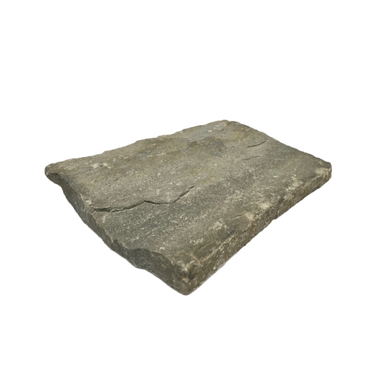 A single flat piece of blue grey sandstone with a rough texture