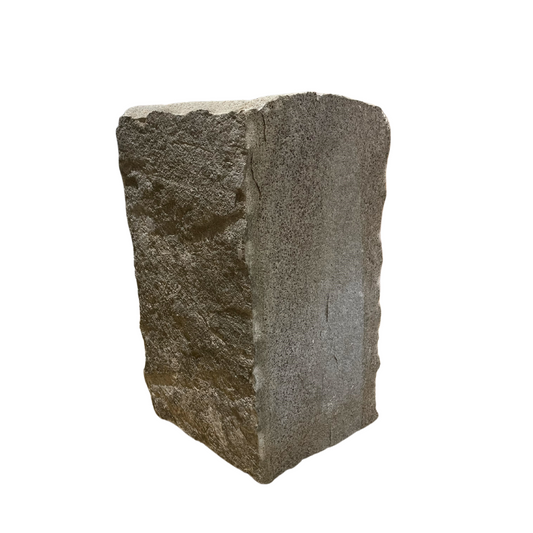 A single Blue Grey Sandstone Stoneer corner piece with a rough, textured surface.