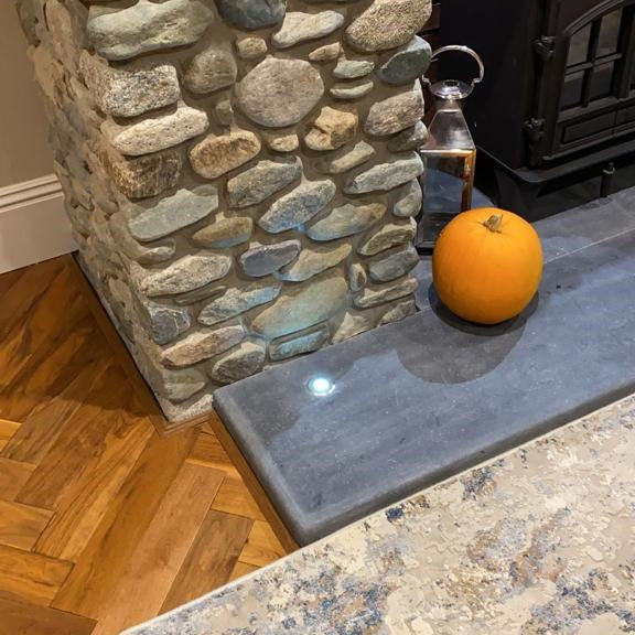 Bespoke Blue Limestone Hearth with a Honed Finish and Semi Bullnose to the front and two sides. 