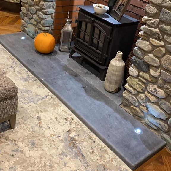 Bespoke Blue Limestone Hearth with a Honed Finish and Semi Bullnose to the front and two sides. 