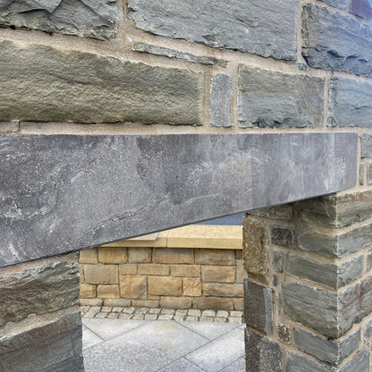 Close-up of a stone wall with blue limestone lintel. 