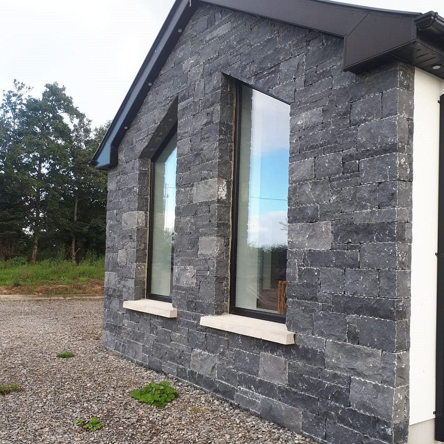 Conservatory completed using Blue Limestone machined walling stone.