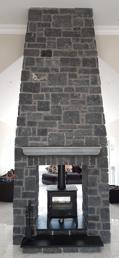 Bespoke Blue Limestone Mantel with moulded profile on a large double sided Blue Limestone Building Stone Fireplace. 