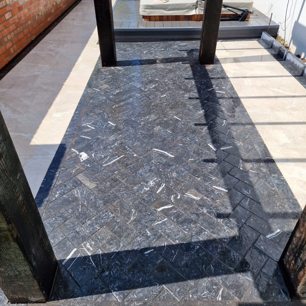 Patio area featuring Blue Limestone Cobbles laid in herringbone style with 200 x 100mm size. 