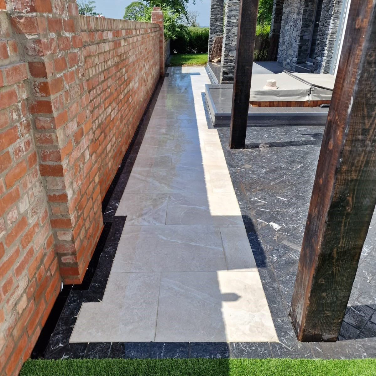 Patio area featuring Blue Limestone Paving Cobbles in 200 x 100mm size.