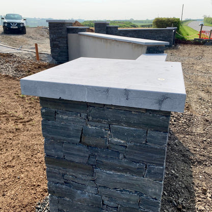 Newly built entrance walls and pillars completed in liscannor slate and bespoke flat blue limestone wall and pillar capping. 