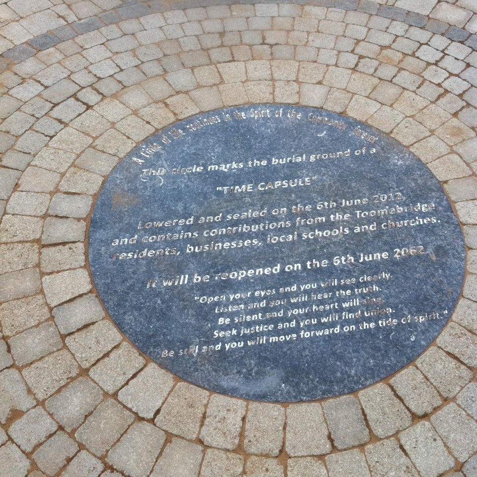 Bespoke Blue Limestone time capsule plaque on a stone pavement