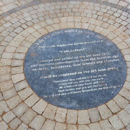 Bespoke Blue Limestone time capsule plaque on a stone pavement