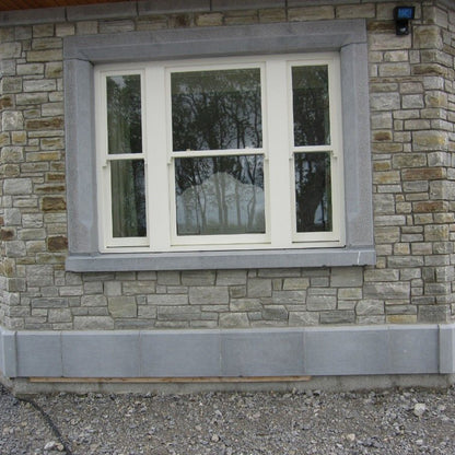 Bespoke Blue Limestone Window Surround and Plinths. 