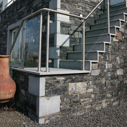 Architectural Limestone steps on a stone house with bespoke Limestone Corner Quoins. 