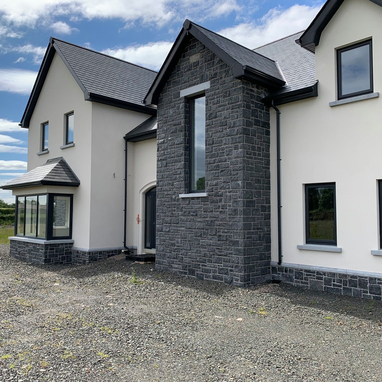 Modern two story house with bespoke blue limestone sills. 