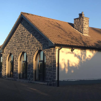 House renovation with new feature wall and chimney cladded in Blue Limestone Stoneer Cladding. 