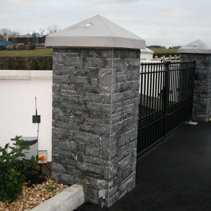 Entrance pillars completed using Blue Limestone Stoneer Cladding and bespoke Limestone pillar cap. 