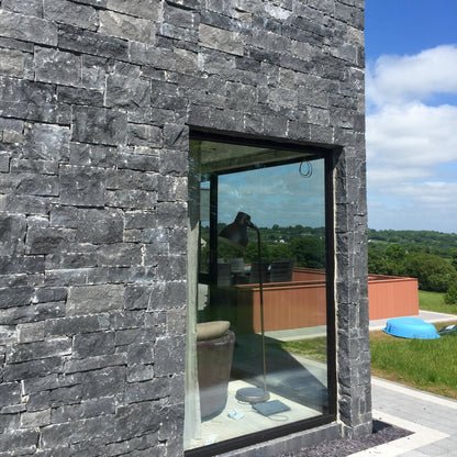 Close up of stonework completed using Blue Limestone Stoneer Cladding. 