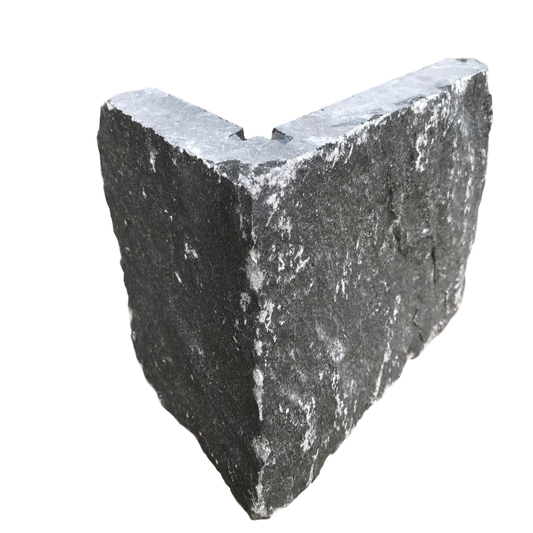 A single blue limestone cladding corner piece against a white background.