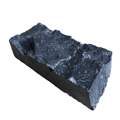 A flat piece of blue limestone stoneer cladding with a rough texture. 