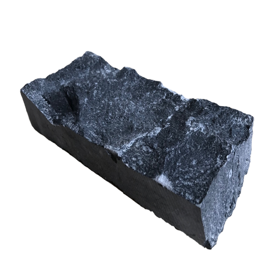 A flat piece of blue limestone stoneer cladding with a rough texture. 