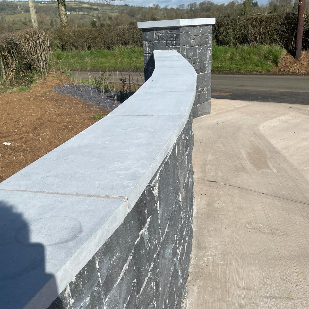 Blue Limestone wall capping in flat smooth finish. 