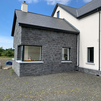 Stone sunroom with bespoke blue limestone window sills with corner splayed returned. 
