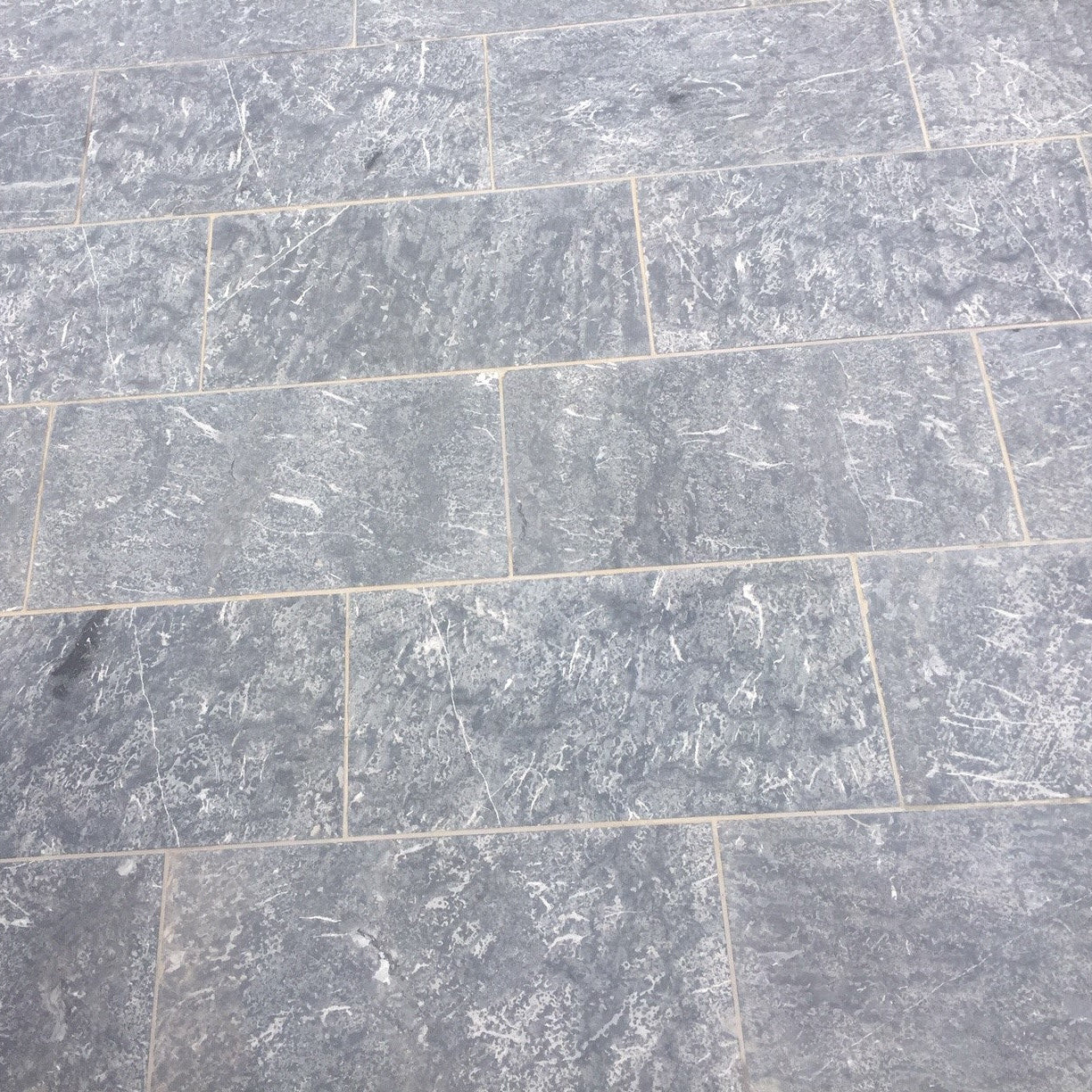 Blue Limestone Paving with a Flamed finish in 600 x 300 x 30mm size. 