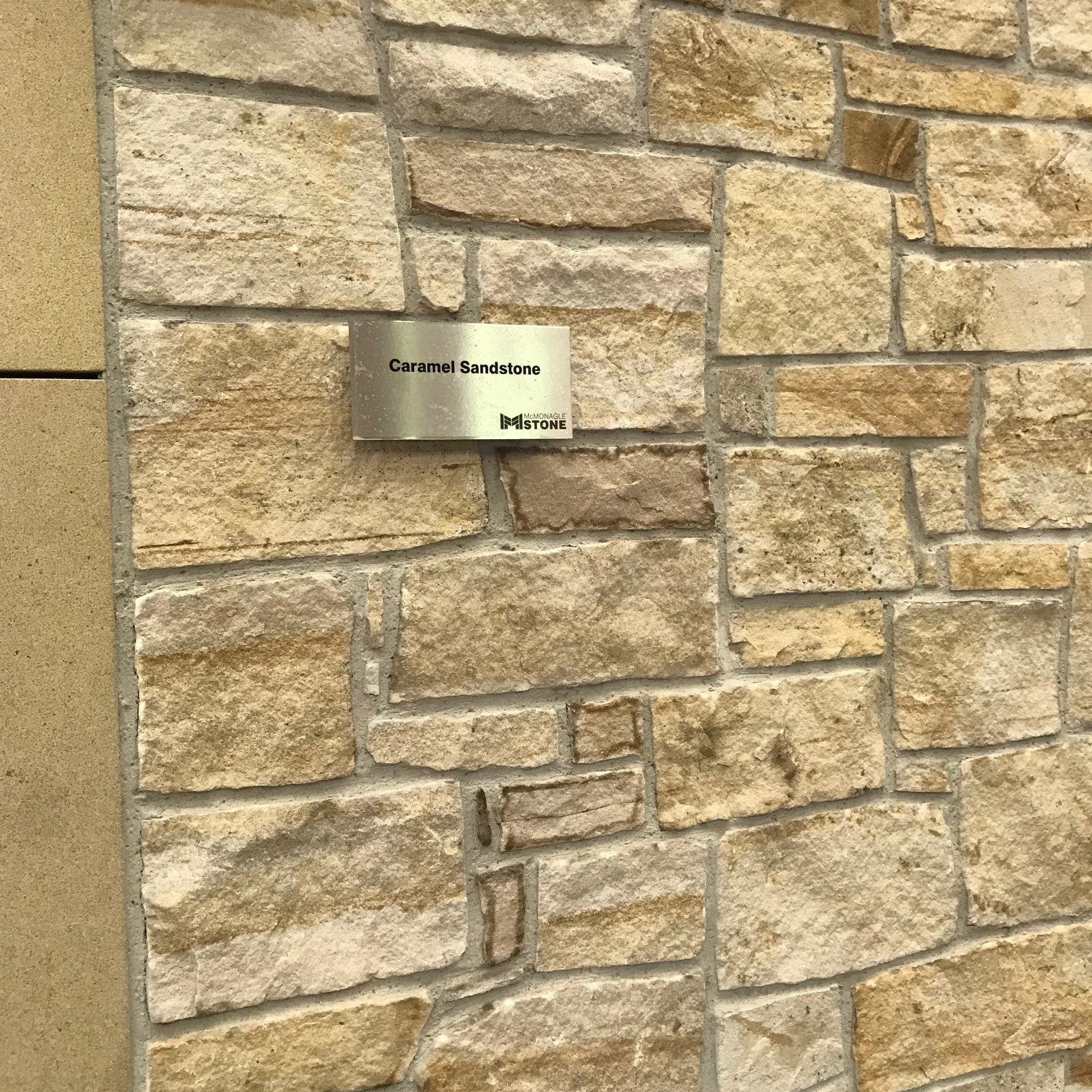 Close up of Caramel Sandstone Machined building stone on display in our Lisburn showroom. 