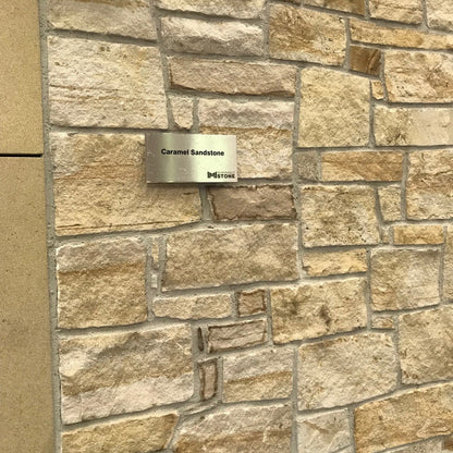 Close up of Caramel Sandstone Machined building stone on display in our Lisburn showroom. 
