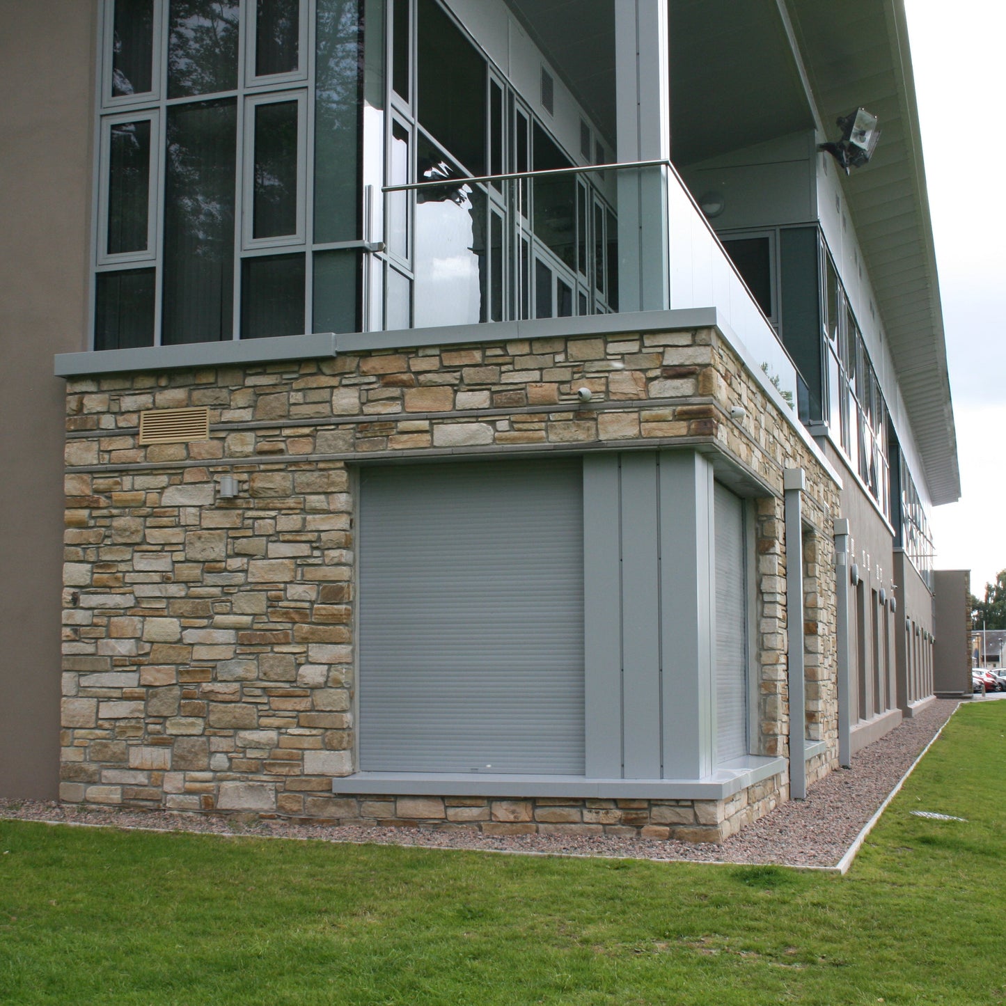 Building with natural stone feature wall completed in Caramel Sandstone machined walling stone. 