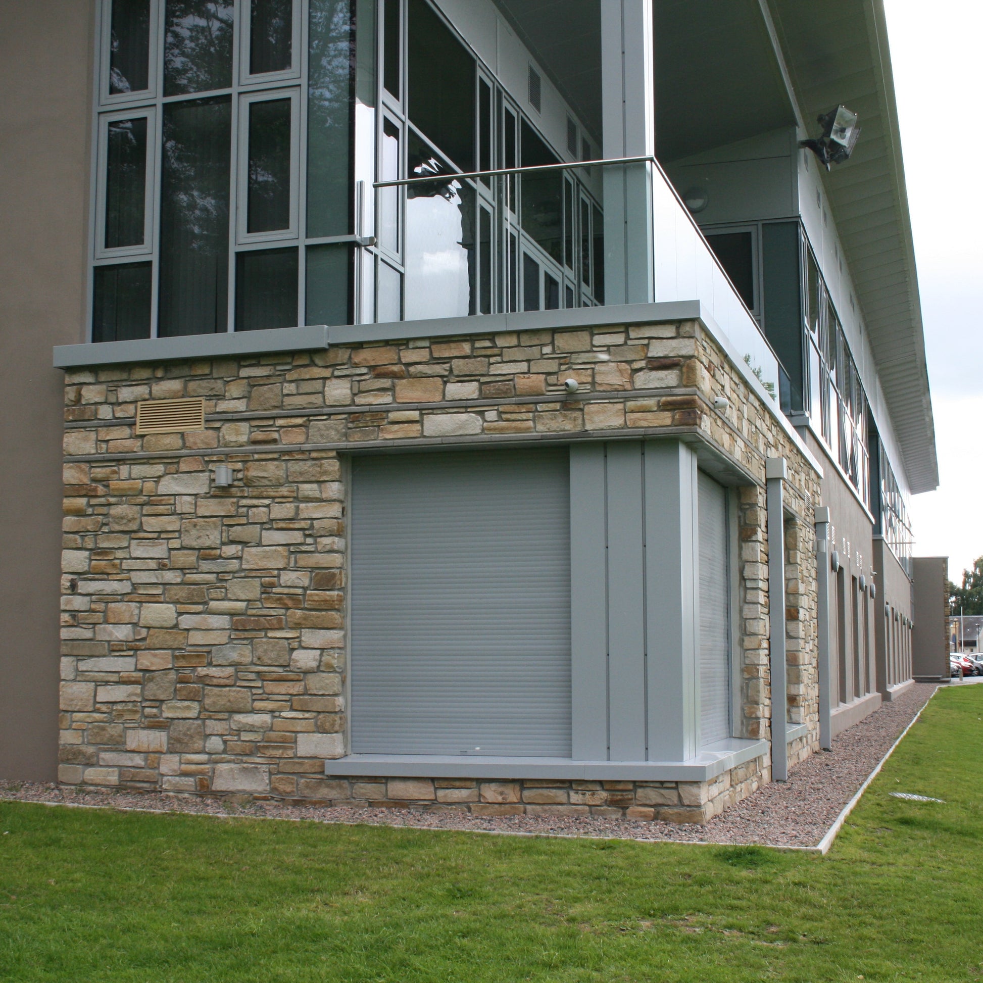 Building with natural stone feature wall completed in Caramel Sandstone machined walling stone. 