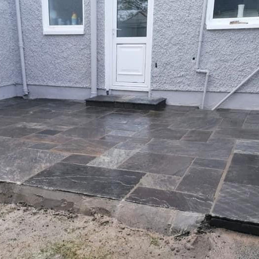 Small patio area and step completed using Cider Black Sandstone Paving.