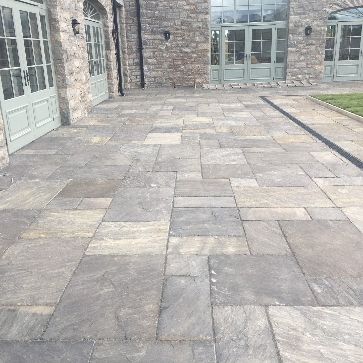 Large patio area completed using Cider Black Sandstone Patio Packs. 