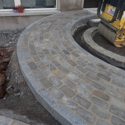 Pathway under construction using Cider Black Sandstone Paving Setts. 