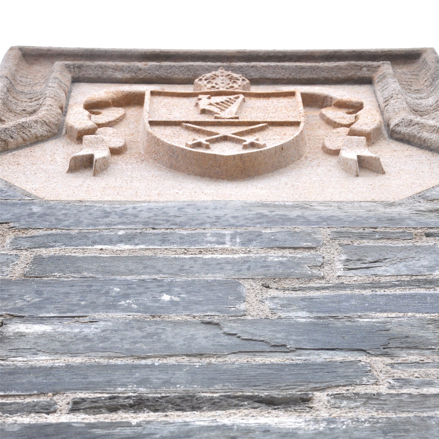 Bespoke Coat of arms in Clipsham Limestone embedded in a stone wall