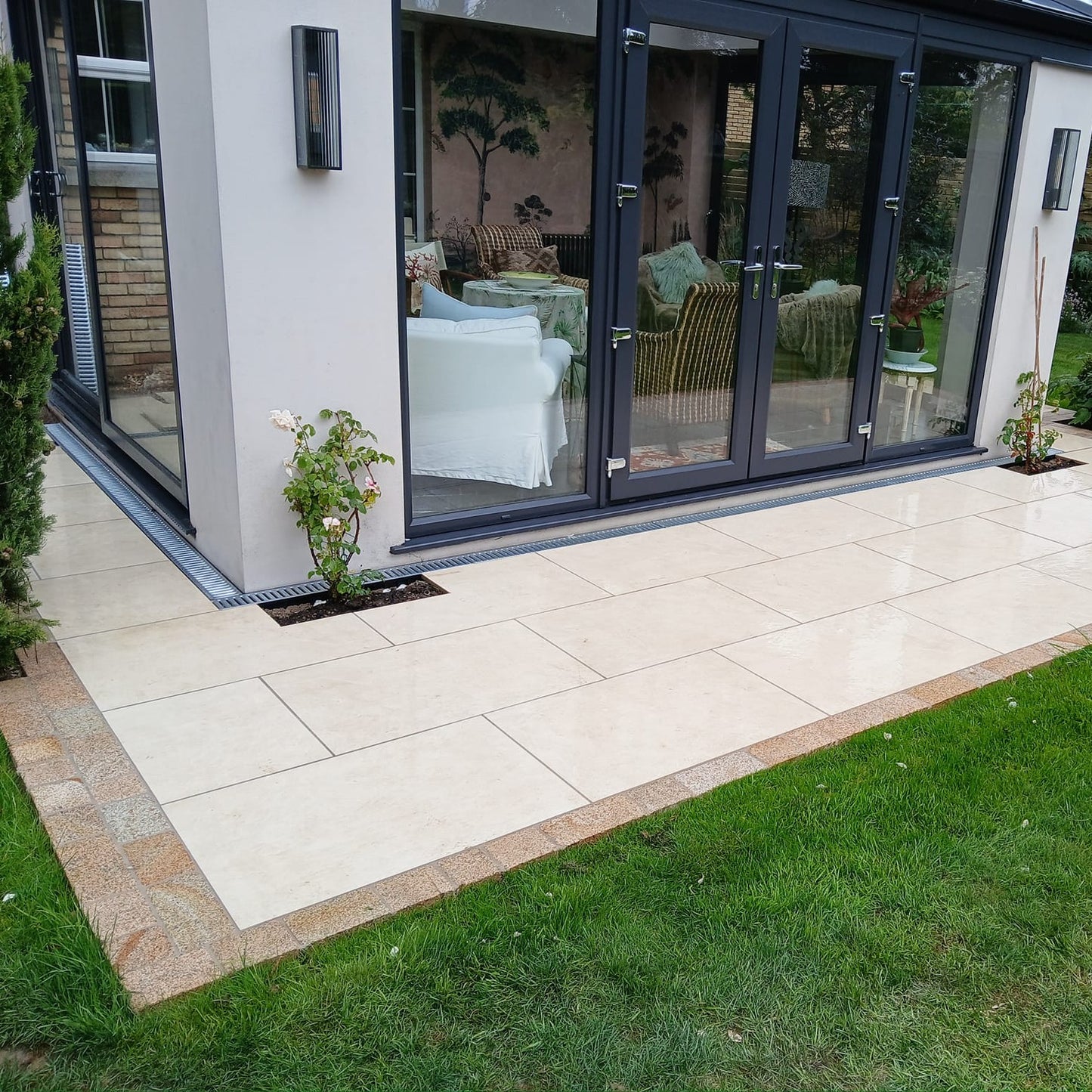 Modern newbuild with pathway border completed using Coachman's Gold Granite Paving Setts. 