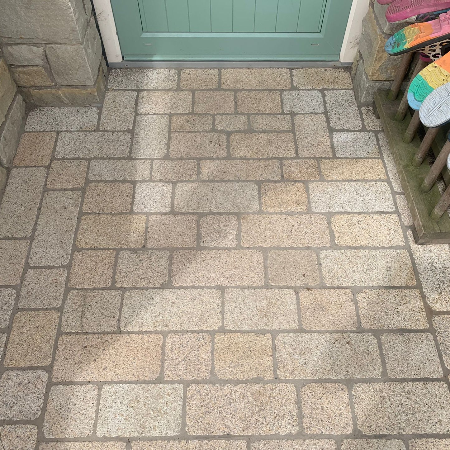 Back door entrance completed using Coachman's Gold Granite Paving Setts, showing a contemporary look with a bush hammered surface finish and tumbled edges.