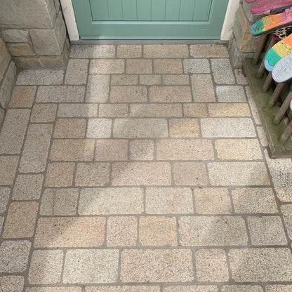 Back door entrance completed using Coachman's Gold Granite Paving Setts, showing a contemporary look with a bush hammered surface finish and tumbled edges.