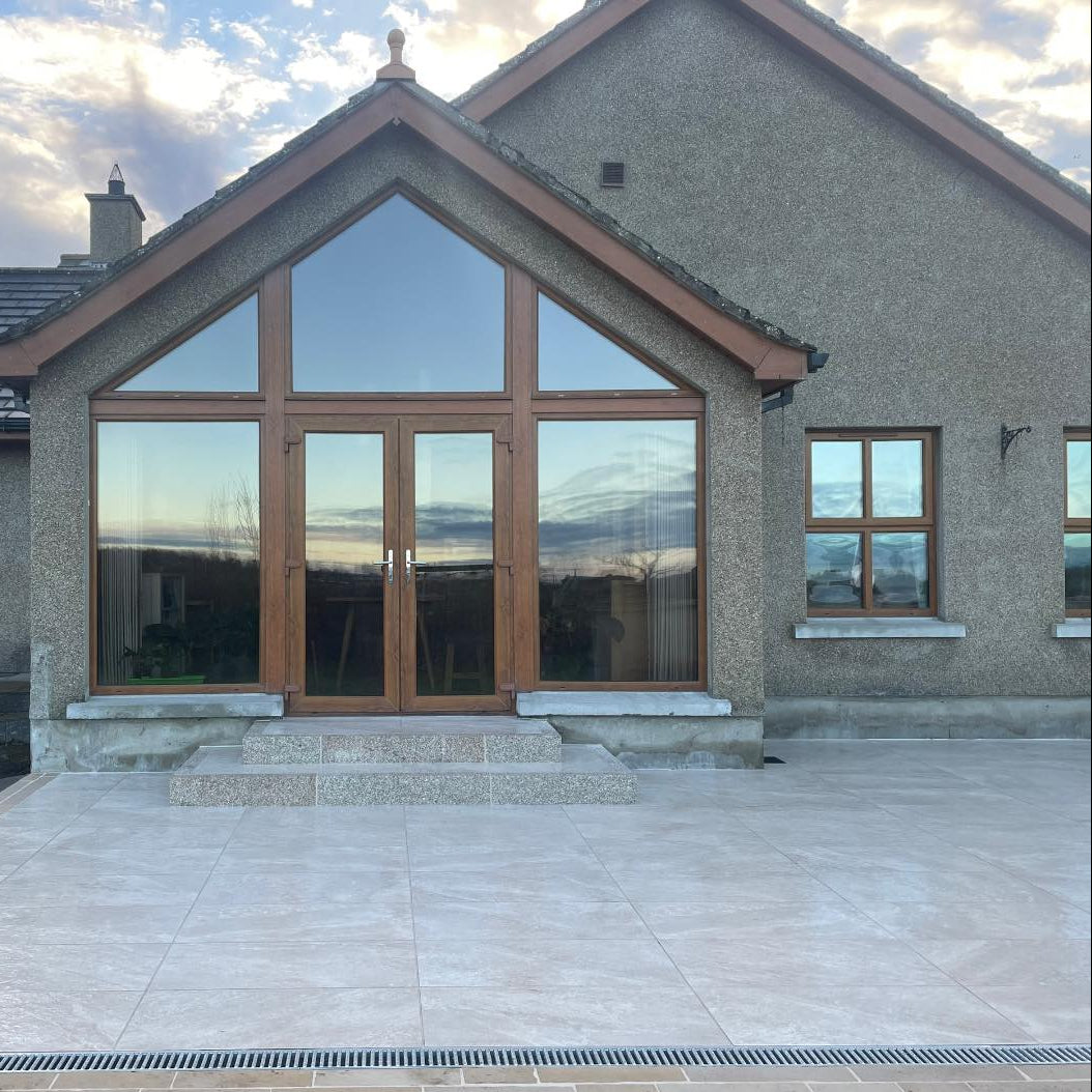 Patio upgrade featuring Cream Twice Qz Range Porcelain Paving Tiles. 