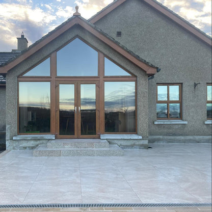 Patio upgrade featuring Cream Twice Qz Range Porcelain Paving Tiles. 