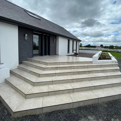 Modern step entrance completed using Cream Twice Qz Range Porcelain Paving Tiles. 