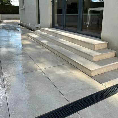 Patio area and steps completed using Cream Twice Qz Range Porcelain Paving Tiles. 