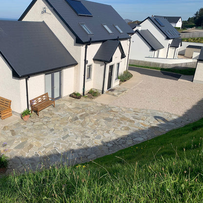 Patio area to the rear of a new build house completed using Donegal Quartzite Crazy Paving. 
