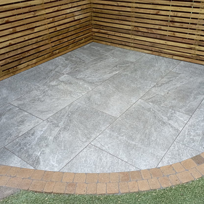 Small patio area featuring Dark Twice Qz Range Porcelain Paving Tiles. 