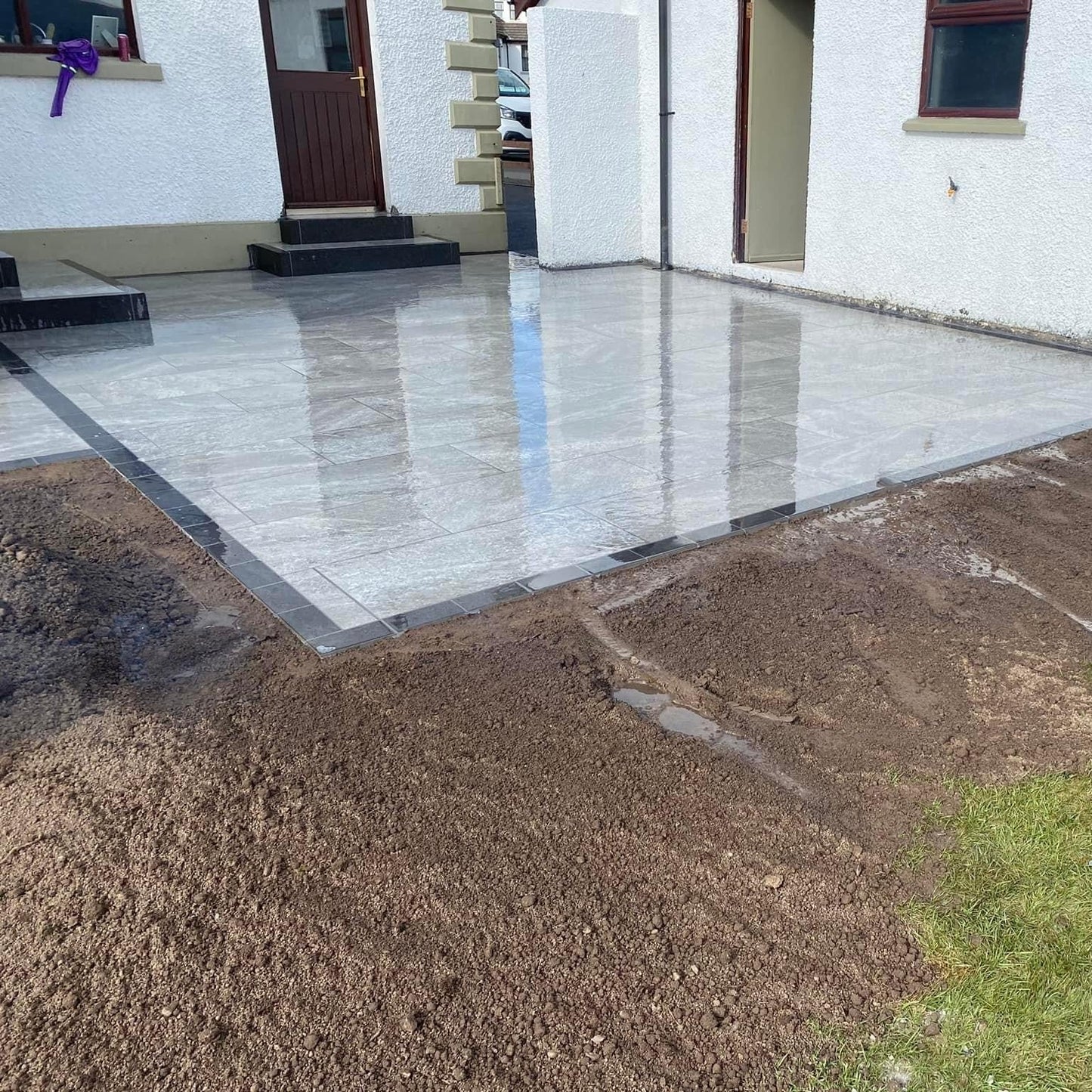 Patio completed using Dark Twice Qz Range Porcelain Paving Tiles. 