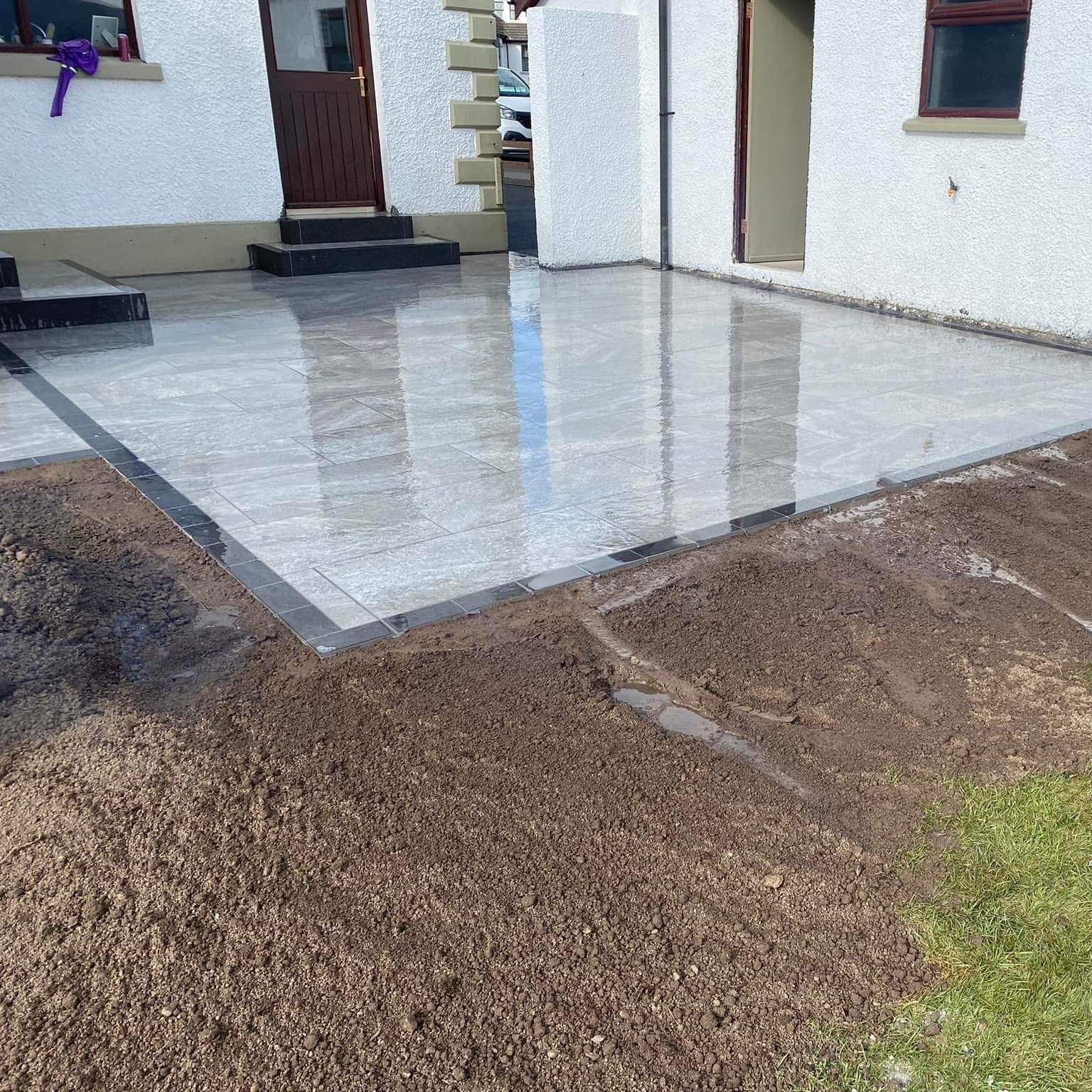 Patio completed using Dark Twice Qz Range Porcelain Paving Tiles. 