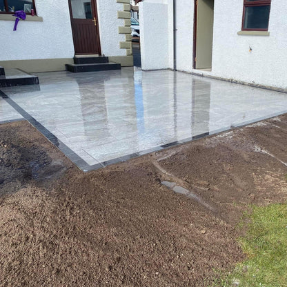 Patio completed using Dark Twice Qz Range Porcelain Paving Tiles. 