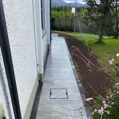 Garden pathway featuring Dark Twice Qz Range Porcelain Paving Tiles. 