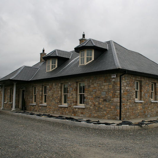 Stone house with Donegal Granite Machined building stone. 