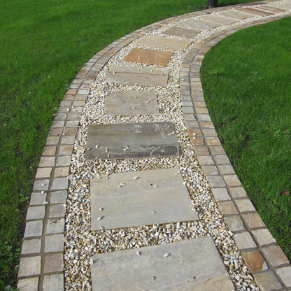 Pathway with stepping stones and natural stone chipping with a double row of Donegal Quartzite Cobbles in 100 x 100mm size. 