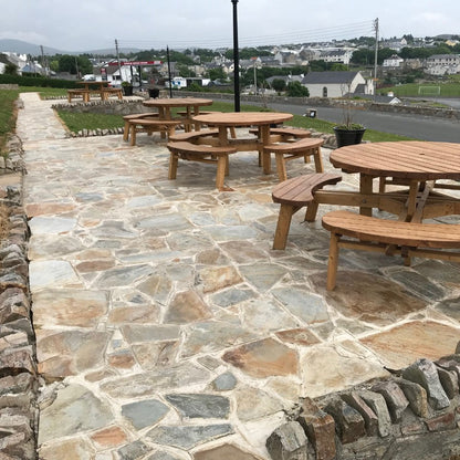 Picnic area with tables and chairs on Donegal Quartzite Crazy Paving. 