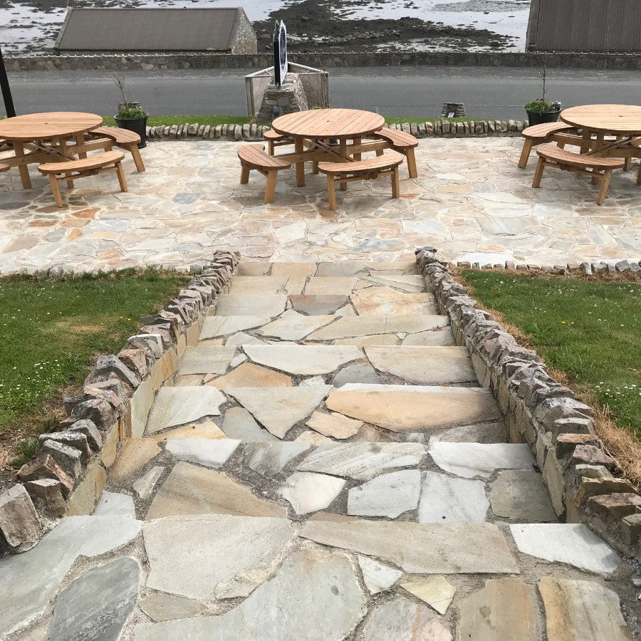 Stone steps leading down to a picnic area completed in Donegal Quartzite Crazy Paving. 