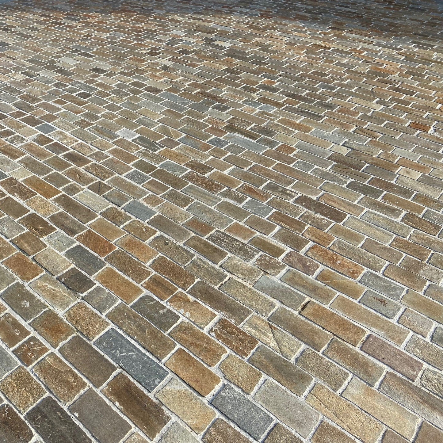 Close up of driveway completed using Donegal Quartzite Paving Setts in Random Length x 100mm size.